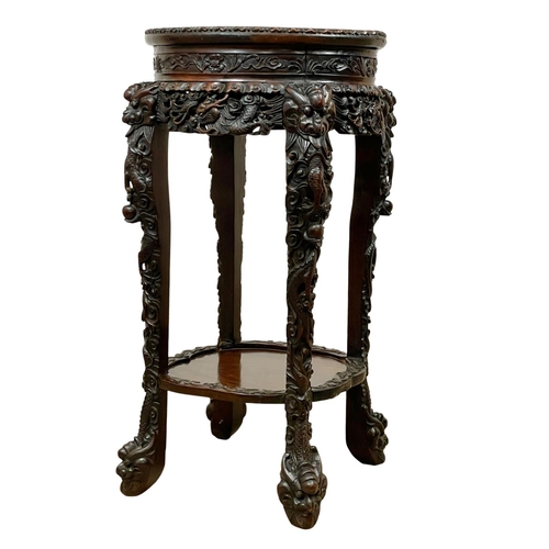 860 - A large Chinese 19th century carved Paduak wood plantstand with marble top. 41 x 83cm