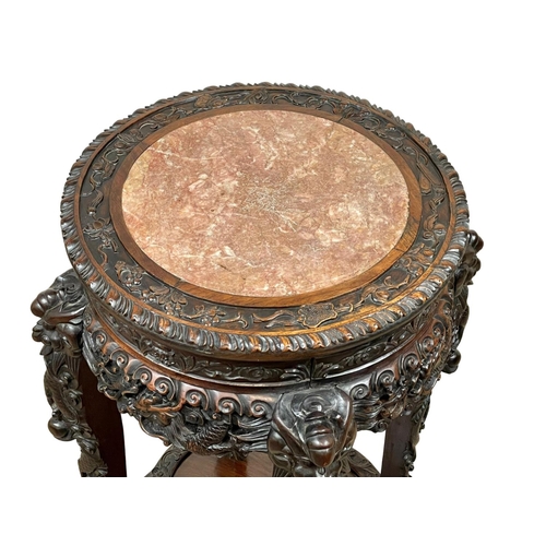 860 - A large Chinese 19th century carved Paduak wood plantstand with marble top. 41 x 83cm