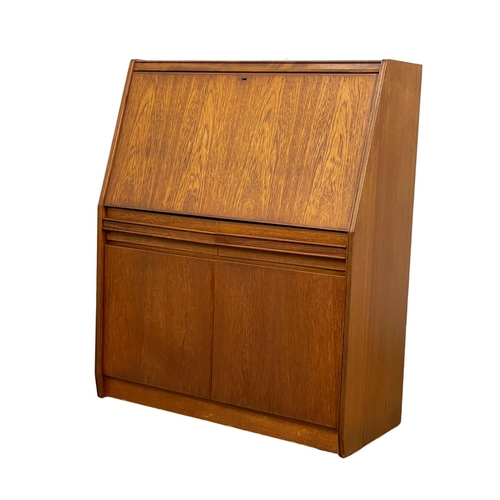 914 - A Mid Century teak bureau by Remploy. 91 x 41 x 111.5cm