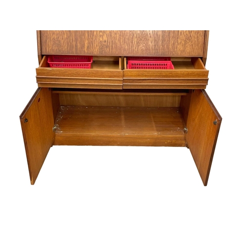 914 - A Mid Century teak bureau by Remploy. 91 x 41 x 111.5cm