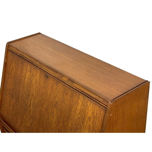 914 - A Mid Century teak bureau by Remploy. 91 x 41 x 111.5cm