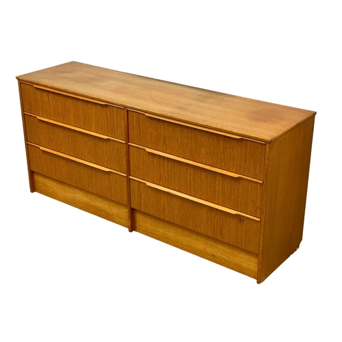 915 - A large Mid Century teak chest of drawers. 1960’s. 147 x 41 x 67cm