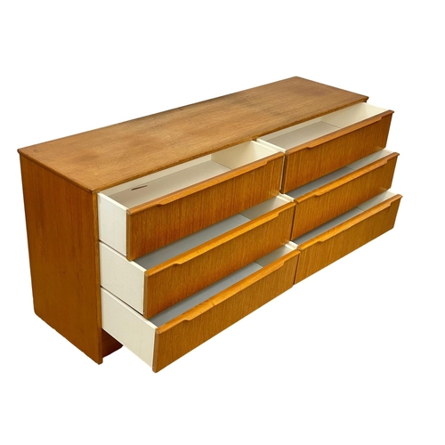 915 - A large Mid Century teak chest of drawers. 1960’s. 147 x 41 x 67cm