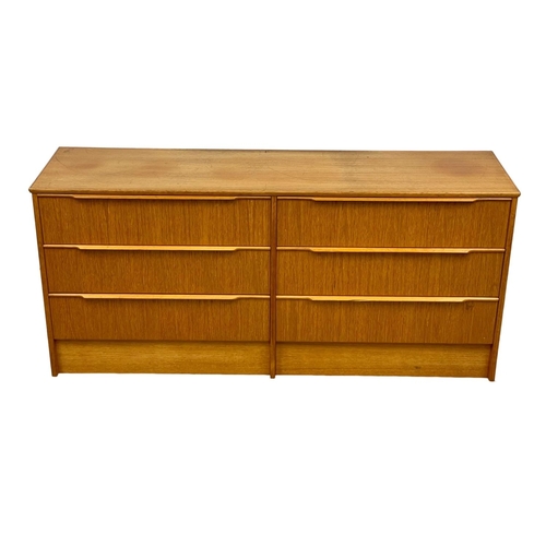 915 - A large Mid Century teak chest of drawers. 1960’s. 147 x 41 x 67cm