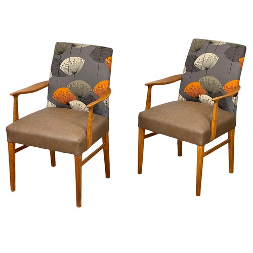 906 - A pair of good quality Mid Century teak carver armchairs. 1960’s