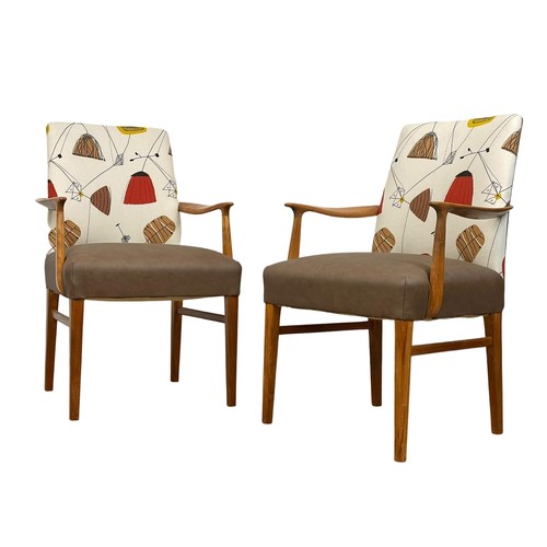 909 - A pair of good quality Mid Century teak carver armchairs. 1960’s.