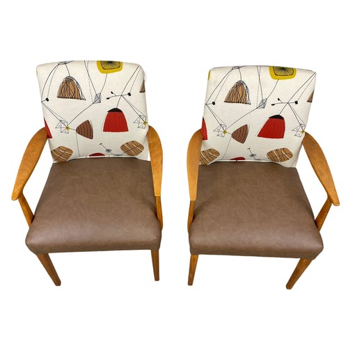 909 - A pair of good quality Mid Century teak carver armchairs. 1960’s.