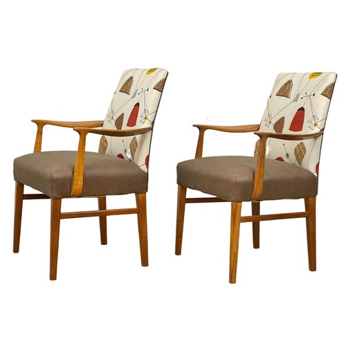 909 - A pair of good quality Mid Century teak carver armchairs. 1960’s.