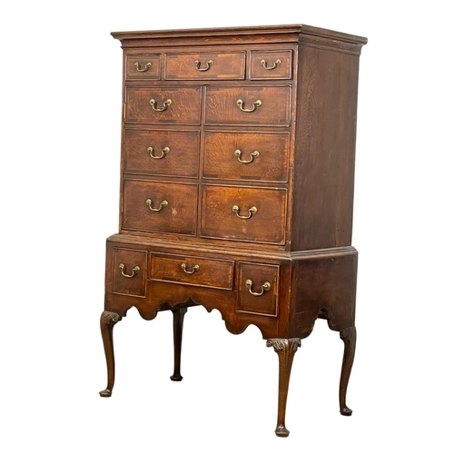 880 - An early George III oak chest on stand, with mahogany cross banding. Circa 1760. 101 x 54 x 164.5cm