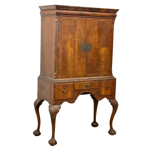 881 - A large early 20th century George III style mahogany cocktail cabinet with 3 drawers and on Ball & C... 