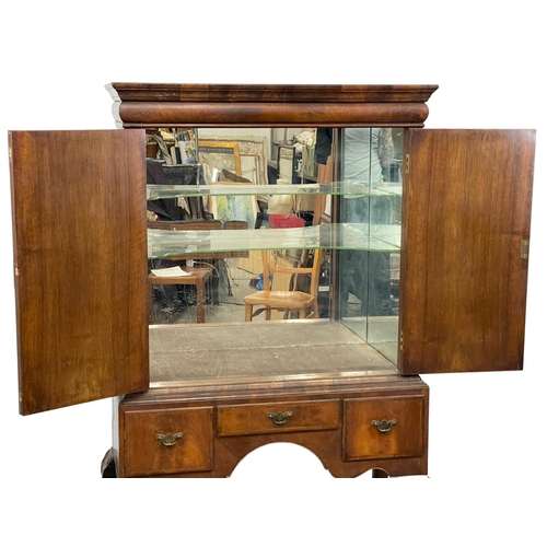 881 - A large early 20th century George III style mahogany cocktail cabinet with 3 drawers and on Ball & C... 