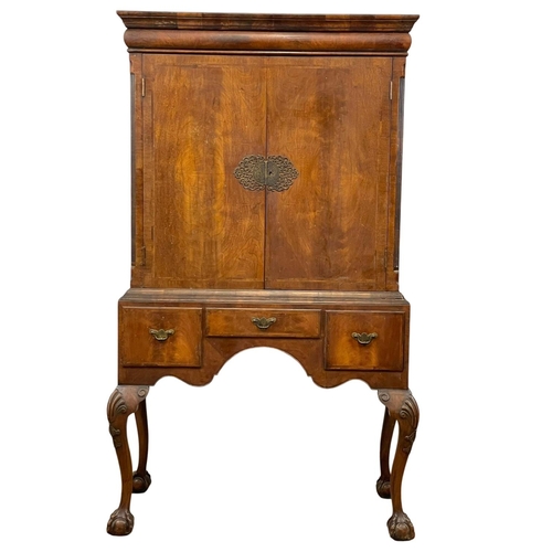 881 - A large early 20th century George III style mahogany cocktail cabinet with 3 drawers and on Ball & C... 