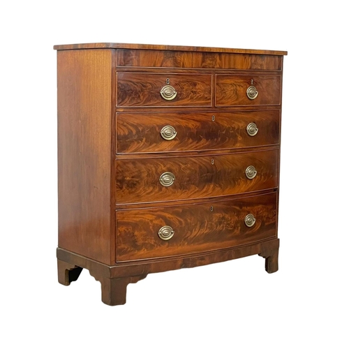 886 - A large late George III flamed mahogany bow front chest of drawers. Circa 1800-1810. 110 x 56 x 117c... 