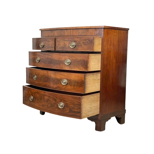 886 - A large late George III flamed mahogany bow front chest of drawers. Circa 1800-1810. 110 x 56 x 117c... 