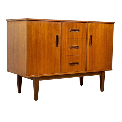 890 - A compact Mid Century teak sideboard. 1960’s. 108 x 46.5 x 77cm