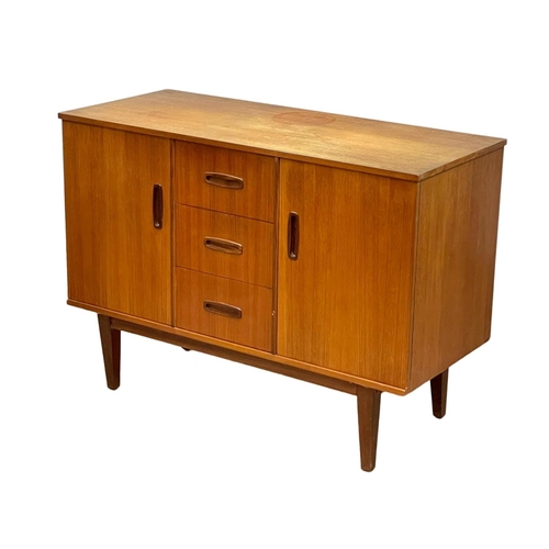 890 - A compact Mid Century teak sideboard. 1960’s. 108 x 46.5 x 77cm