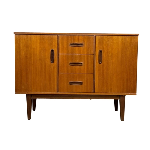 890 - A compact Mid Century teak sideboard. 1960’s. 108 x 46.5 x 77cm