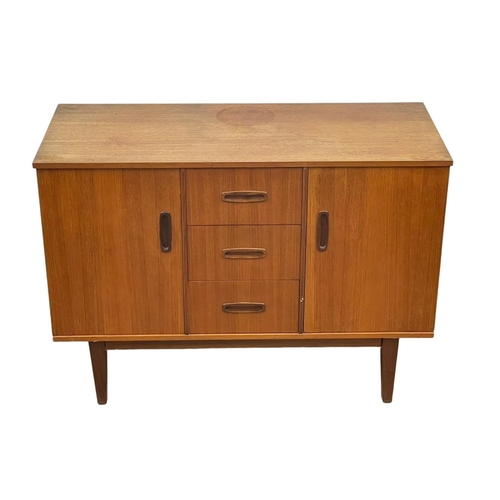 890 - A compact Mid Century teak sideboard. 1960’s. 108 x 46.5 x 77cm