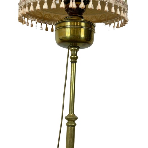 975 - A tall late Victorian brass electrified oil lamp. Circa 1900. 175.5cm