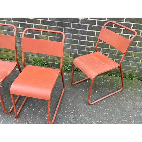 1065 - A set of 4 vintage Cox stacking chairs.