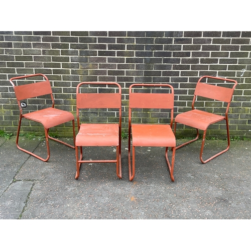 1065 - A set of 4 vintage Cox stacking chairs.