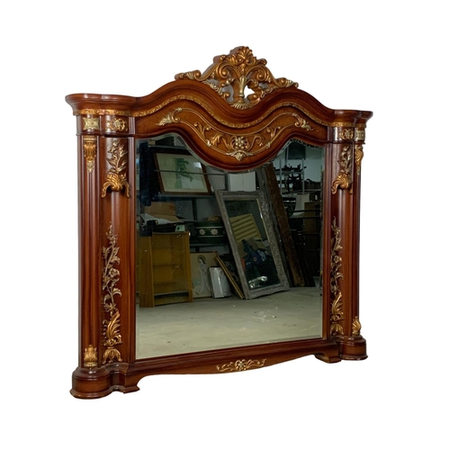 1071 - A large ornate over-mantle mirror. 149 x 146.5cm