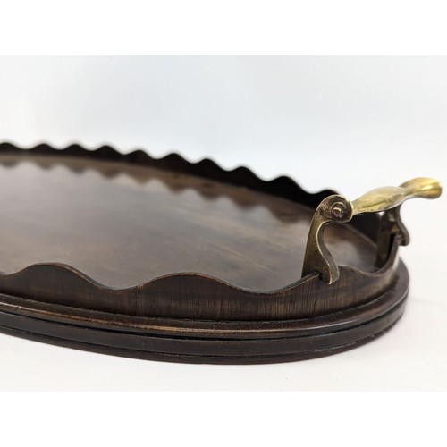 81 - An Edwardian mahogany serving tray. 67x32cm