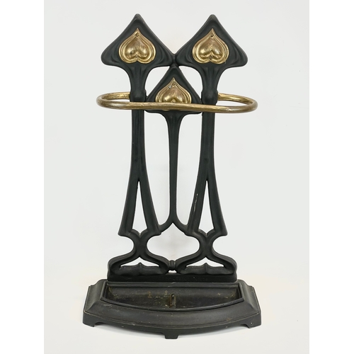 8 - A late 19th century Art Nouveau cast iron and brass stick stand. 43 x 21 x 73.5cm