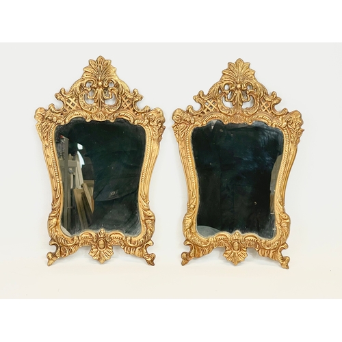 13 - A pair of 18th century style ornate brass framed wall mirrors. 22 x 35cm