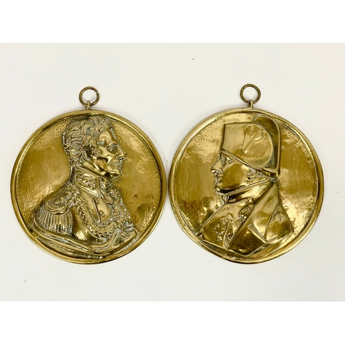 14 - A pair of Victorian heavy brass wall plaques. Duke of Wellington and Napoleon. 17.5cm