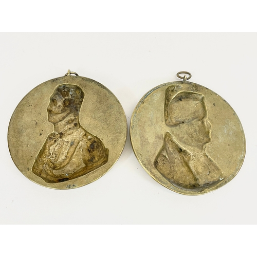 14 - A pair of Victorian heavy brass wall plaques. Duke of Wellington and Napoleon. 17.5cm