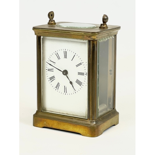 18 - An early 20th century brass carriage clock. 8 x 6 x 11cm