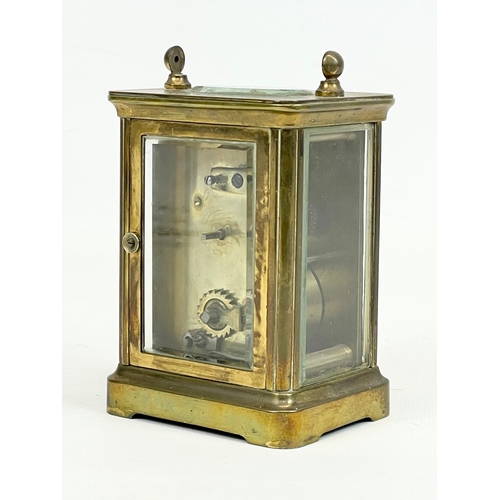 18 - An early 20th century brass carriage clock. 8 x 6 x 11cm
