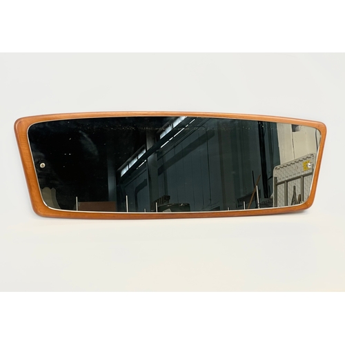 30 - A Mid Century teak framed mirror. 95 x 31cm