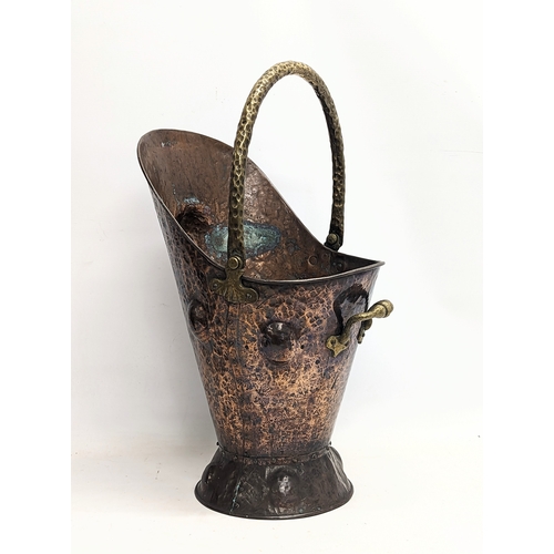 37 - A late 19th century Arts & Crafts copper and brass coal scuttle. 28x52cm