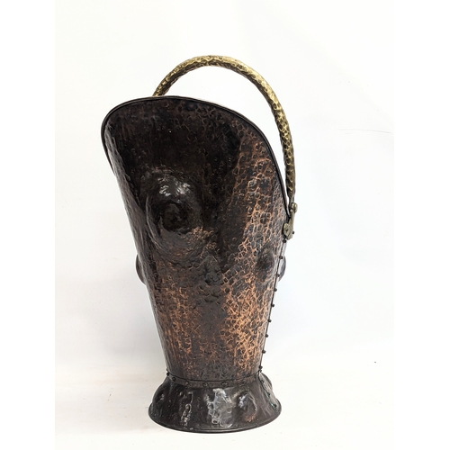 37 - A late 19th century Arts & Crafts copper and brass coal scuttle. 28x52cm