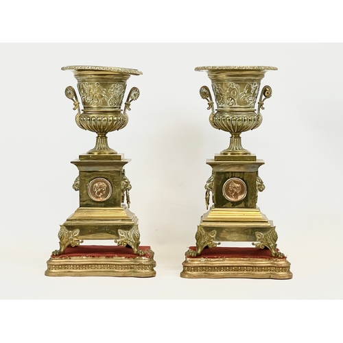 41 - A pair of large mid 19th century gilded brass garnitures on wooden bases. In the Neoclassical style.... 