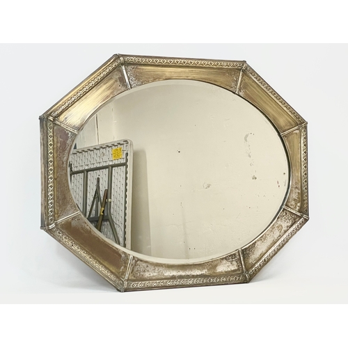 56 - An Arts & Crafts brass framed mirror. Circa 1900. 82 x 61cm