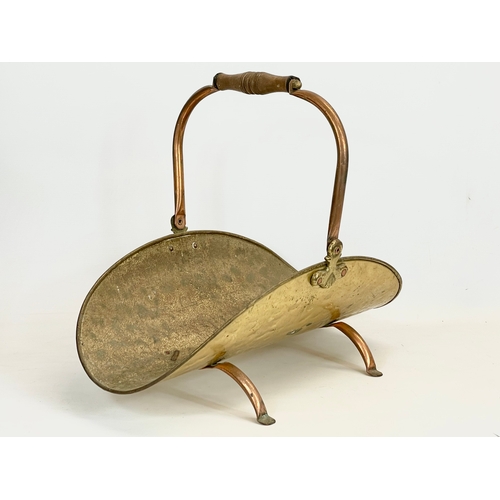 68 - A vintage brass and copper log holder. 30 x 51 x 42cm