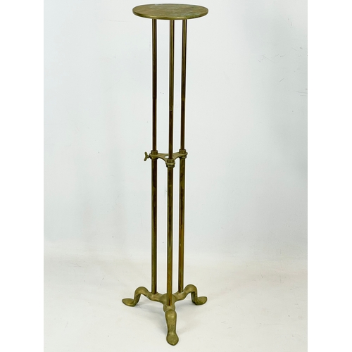 75 - An early 20th century brass telescopic shop display stand by Finlay of London. Lowest height 41.5cm.... 