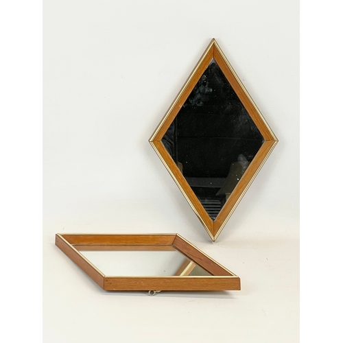 83 - A pair of Mid Century teak framed mirrors, by Rowley Relf. 1960’s. 24 x 38cm