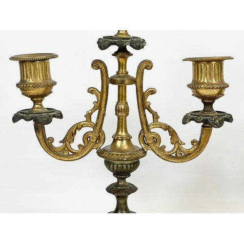 84 - A pair of late Victorian gilt brass candelabras. Circa 1900. 20 x 46cm
