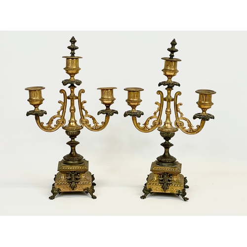 84 - A pair of late Victorian gilt brass candelabras. Circa 1900. 20 x 46cm