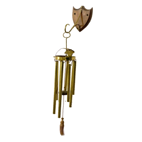 91 - A large early 20th century brass wall mounted wind chime. Circa 1900. 90cm