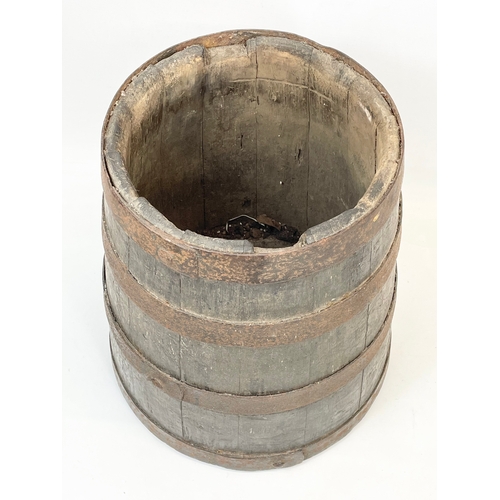 97 - A Victorian oak metal bound barrel. 36 x 40cm