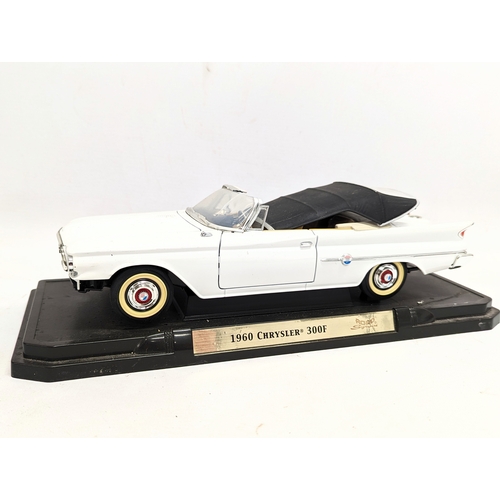 153 - 2 model cars, 1960 Chrysler 300F, and 1961 Chrysler Imperial Crown