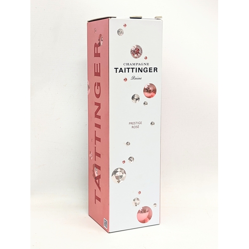 203 - A Taittinger Prestige Rosé NV Champagne.