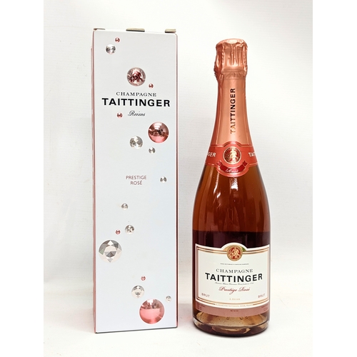 203 - A Taittinger Prestige Rosé NV Champagne.