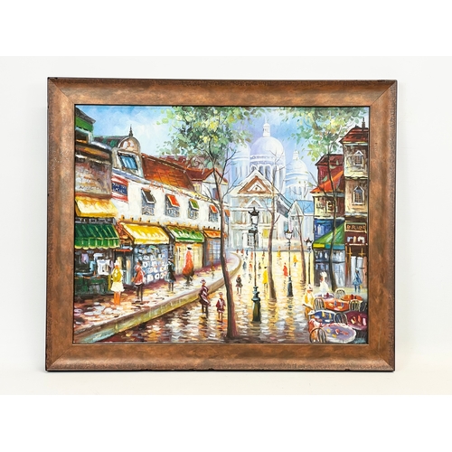 272 - A signed oil painting of street scene. Painting measures 51.5x41.5cm. Frame measures 60.5x50.5cm