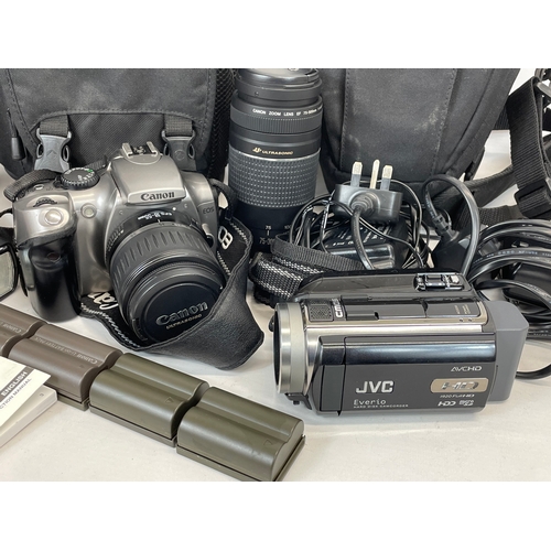 193B - 2 cameras and accessories in cases. Including a Canon EOS 300D, with lens, Yongnuo Speedlite YN560-I... 